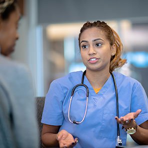 A nurse talking to a doctor