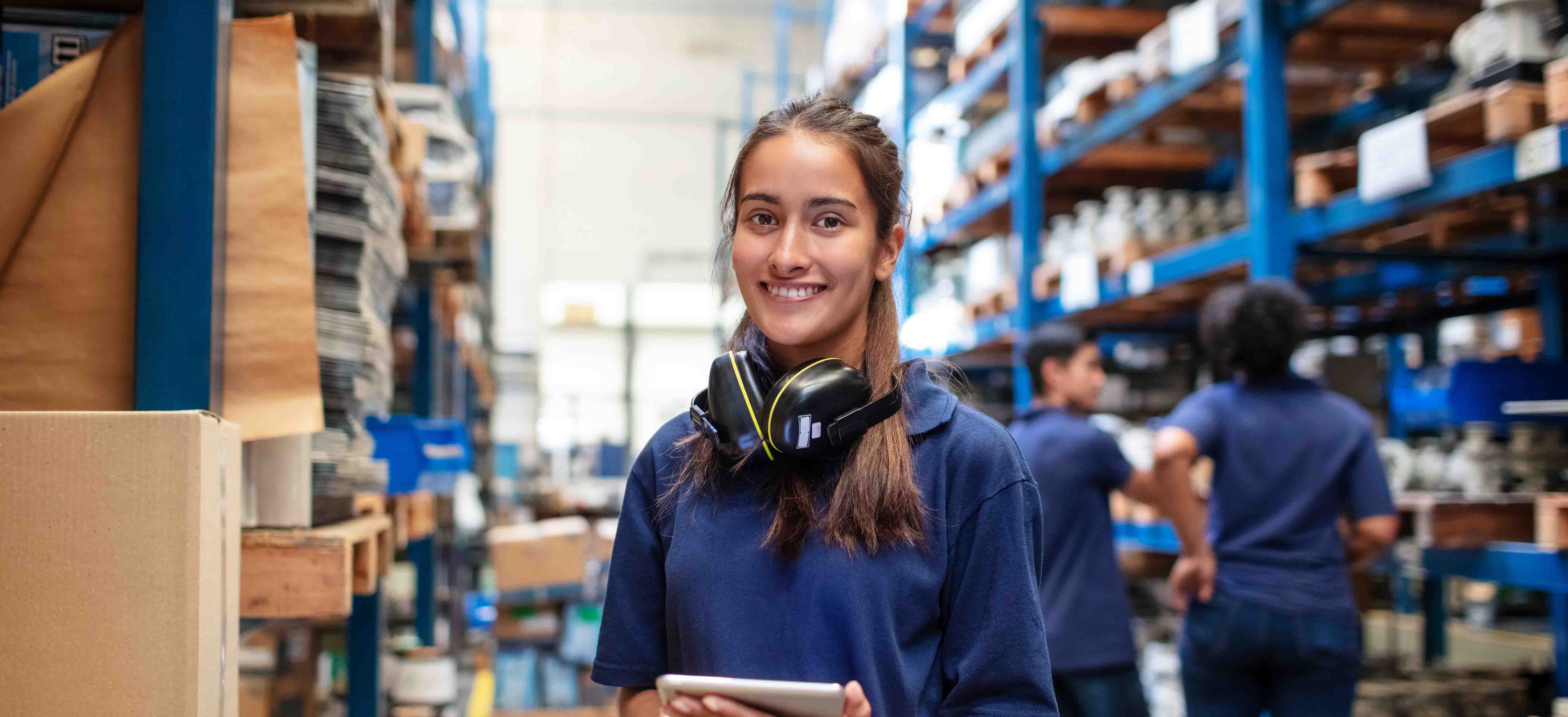 A student smiling and looking at the camera