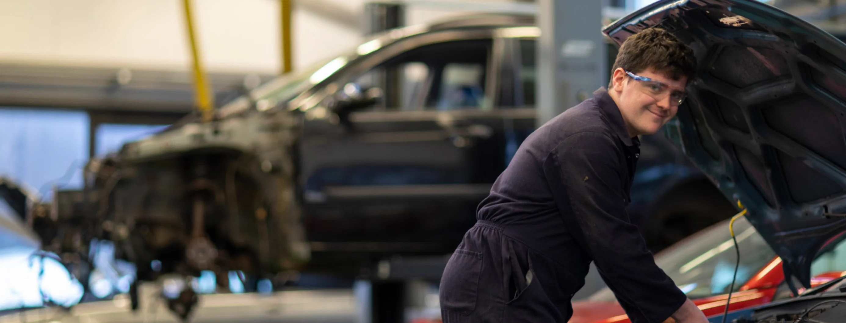 A student working on a car