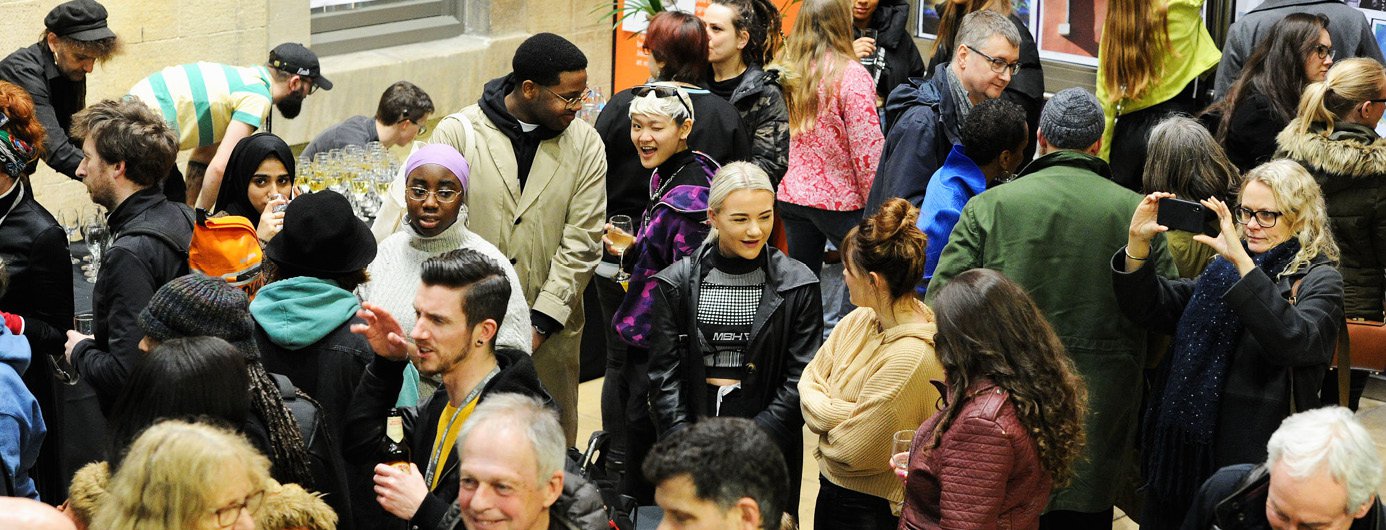 People walking around an open event at Openshaw Campus
